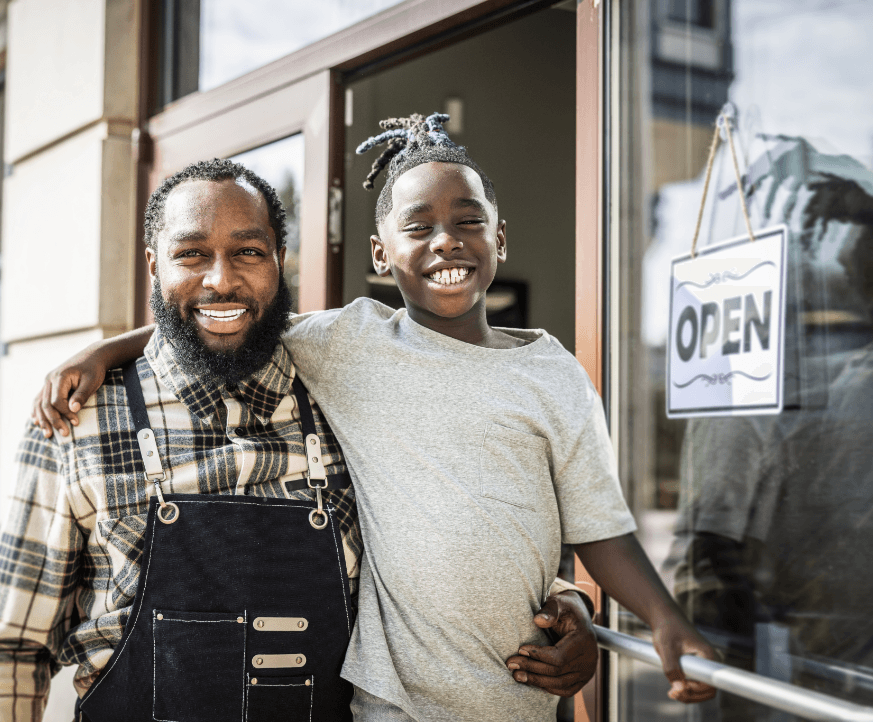 black-owned business owner father and son open for the day