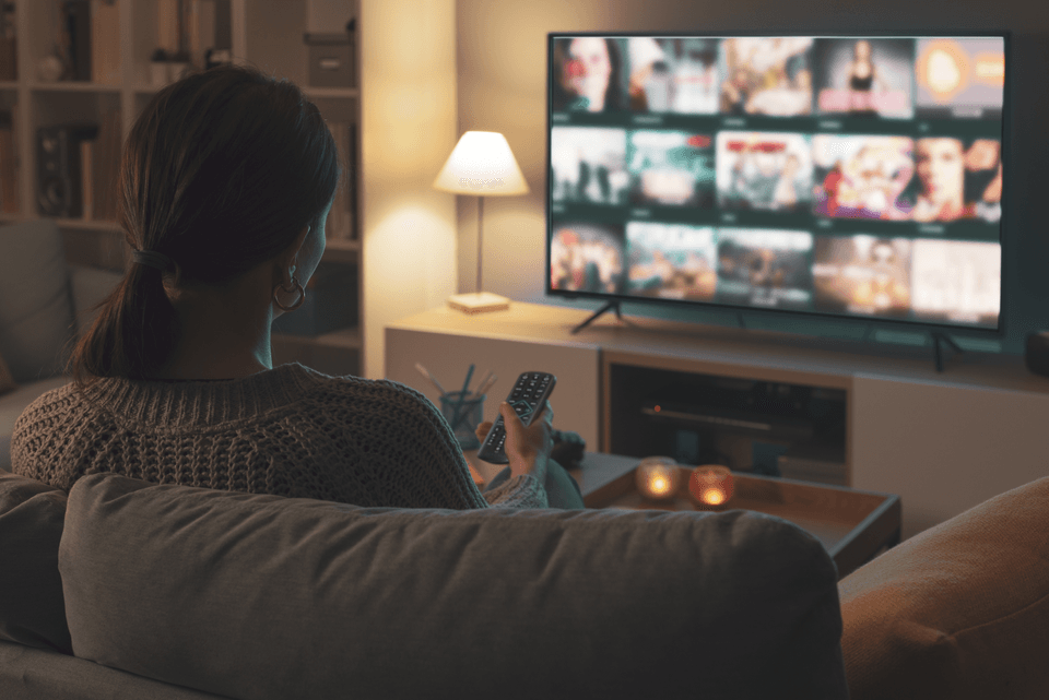lady watching streaming service on home television