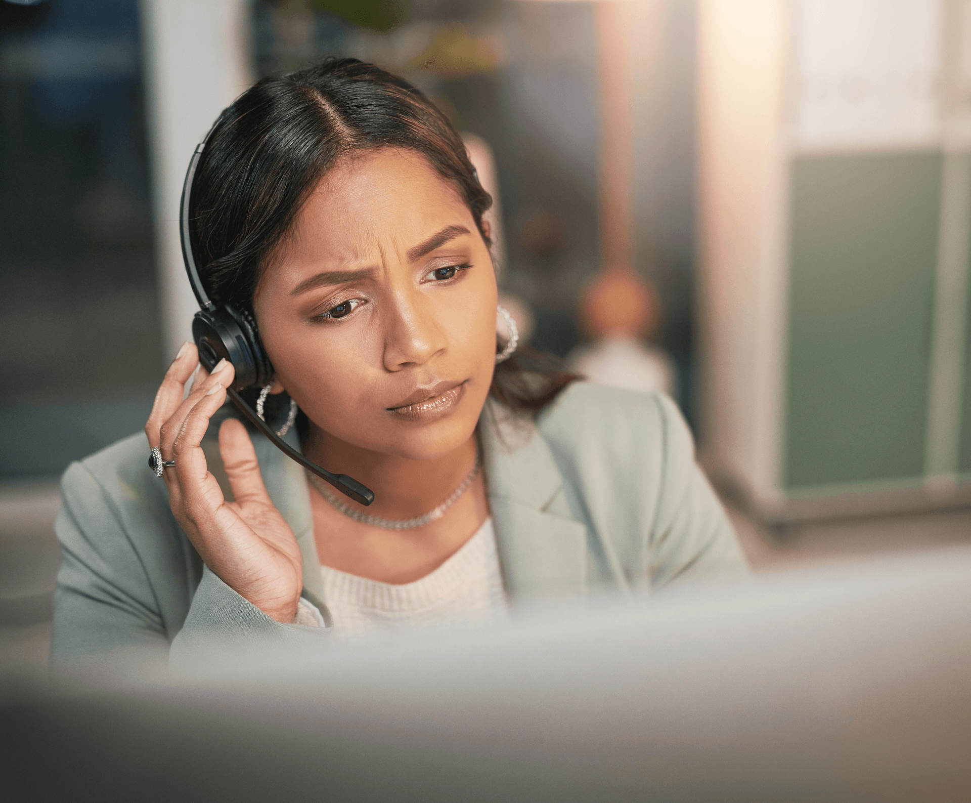 lady with a headset handling a 911 call