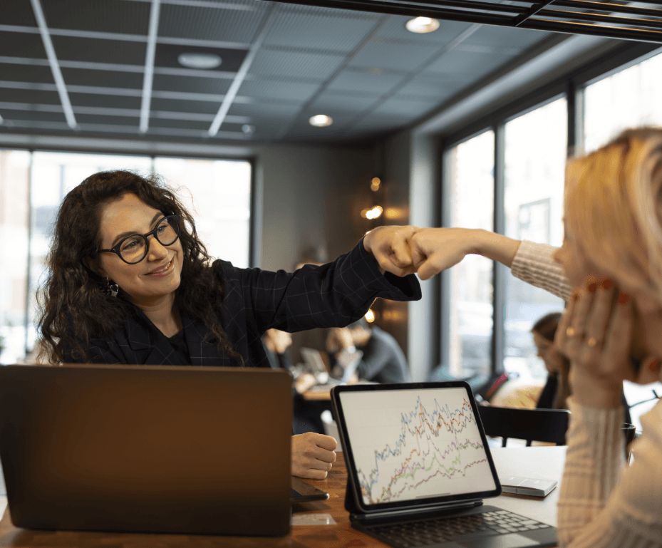 two business partners fist bumping