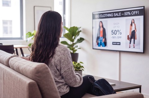 ai created image of lady seeing an ad on home tv