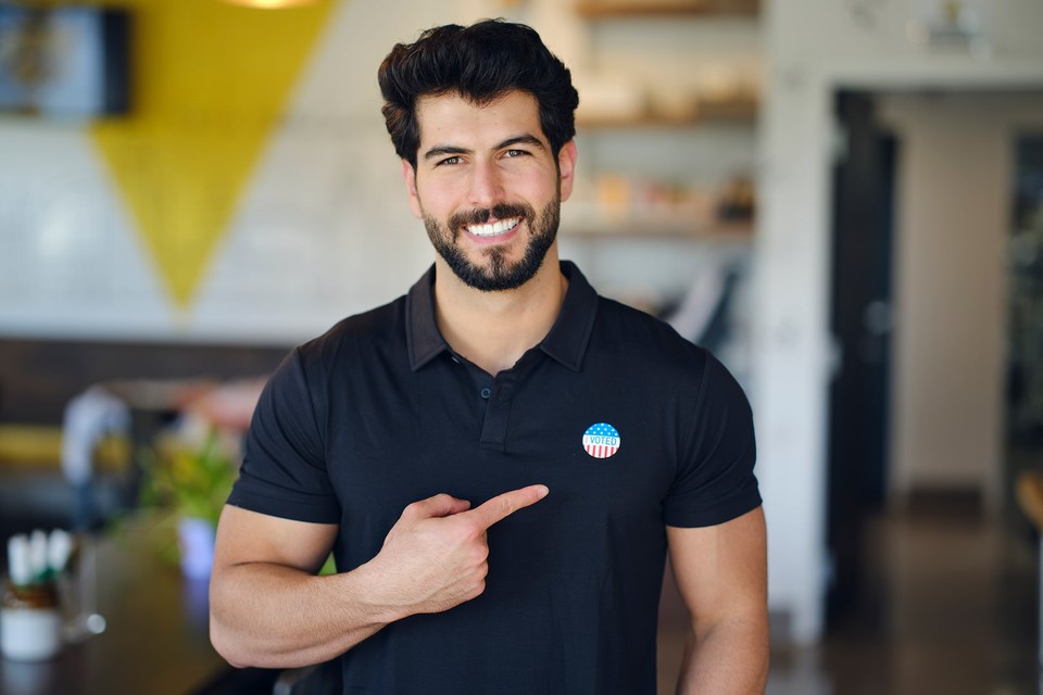 Male voter with a voting sticker