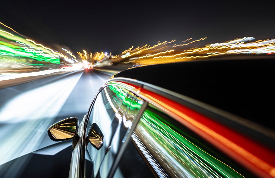 car driving at night with many interesting reflections.