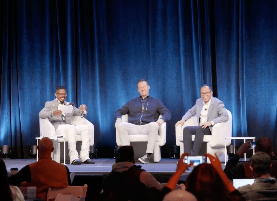 three speakers on stage before discussion began